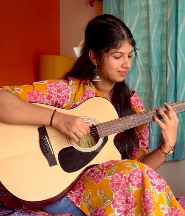 Fingerstyle Guitar Being Played by Aarya